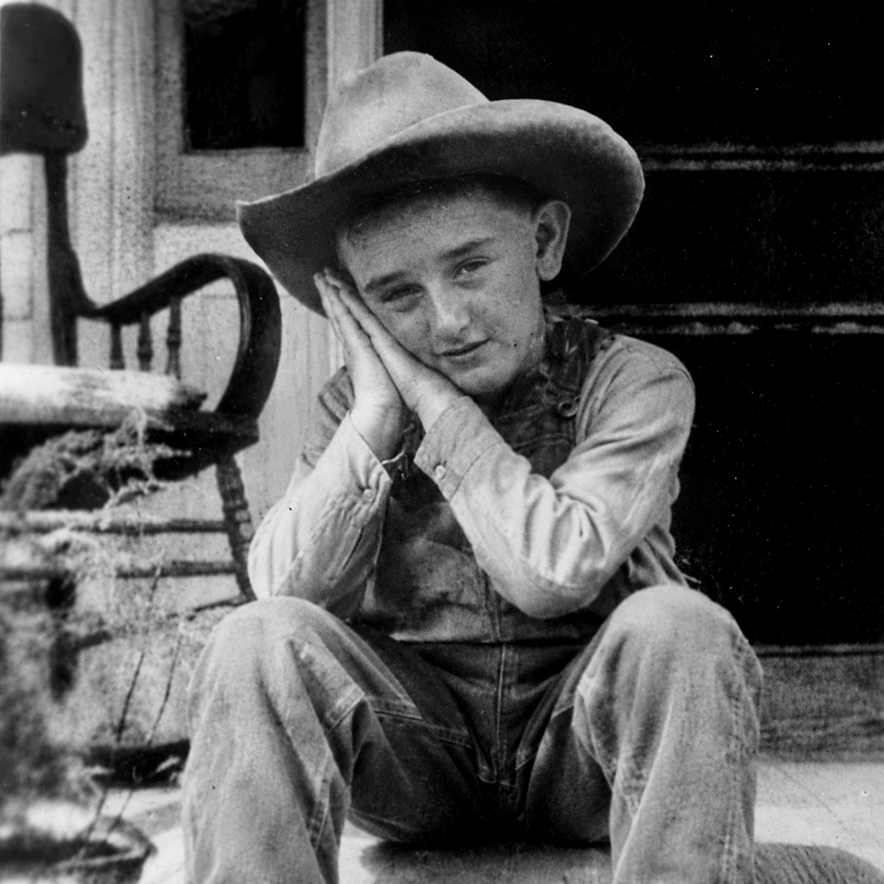 Lyndon b johnson do sleep motion by using hands as pillow with eyes open while looking at the viewer